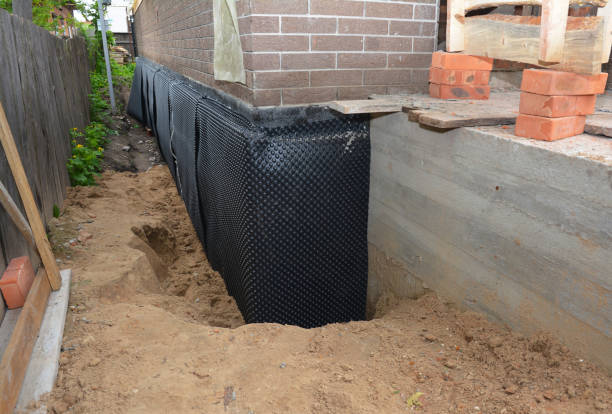 Happy homeowners after waterproofing job in Budd Lake